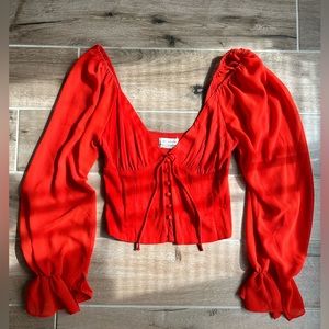 red long sleeve top